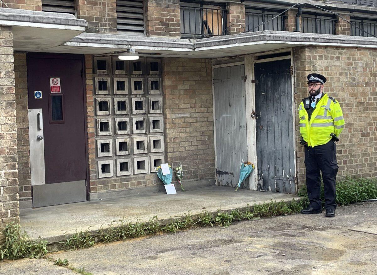 Police at the scene where 45-year-old James Markham was stabbed to death after confronting a group of youths on Aug. 9, 2021, in Churchill Terrace, Chingford, east London, on Aug. 12, 2021. (Laura Parnaby/PA)