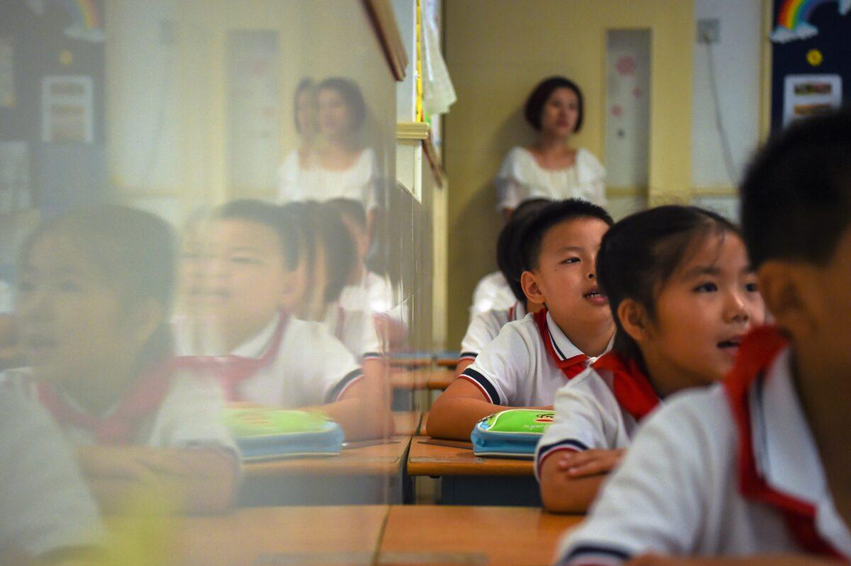 Students sit in a classroom as they study in Shanghai, on Sept. 27, 2017. (Chandan Khanna/AFP via Getty Images)