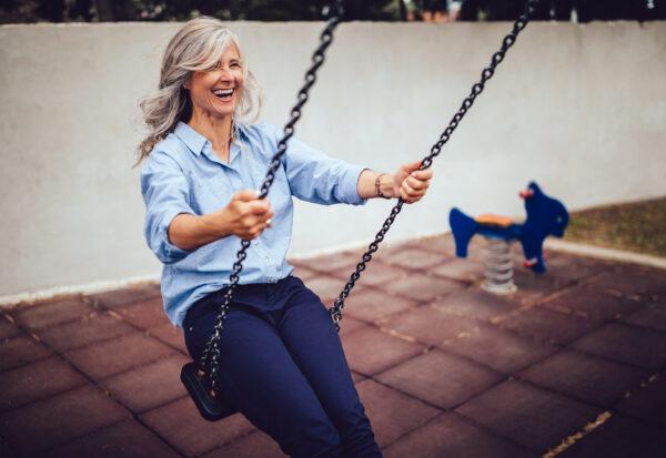 A woman is sitting on swing. (WUNDERVISUALS/GETTY IMAGES)