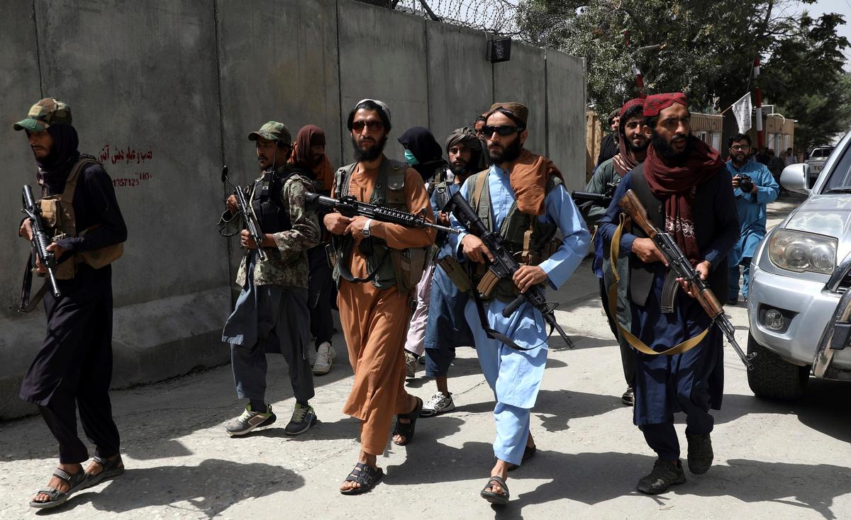 Taliban Violently Break Up Protest in Afghanistan as Thousands Try to Flee Kabul