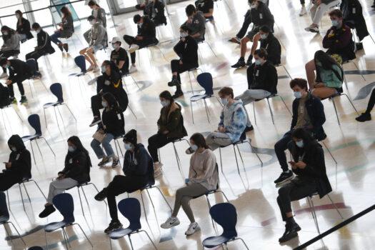 Students wait to receive the Pfizer vaccine for Covid-19 at Qudos Arena in Sydney, Australia, on Aug. 9, 2021 (Dean Lewins-Pool/Getty Images)