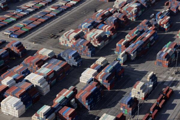 Shipping containers sit on the dock at a container terminal at the Port of Long Beach-Port of Los Angeles complex, in Los Angeles, Calif., on April 7, 2021. (Lucy Nicholson/Reuters)