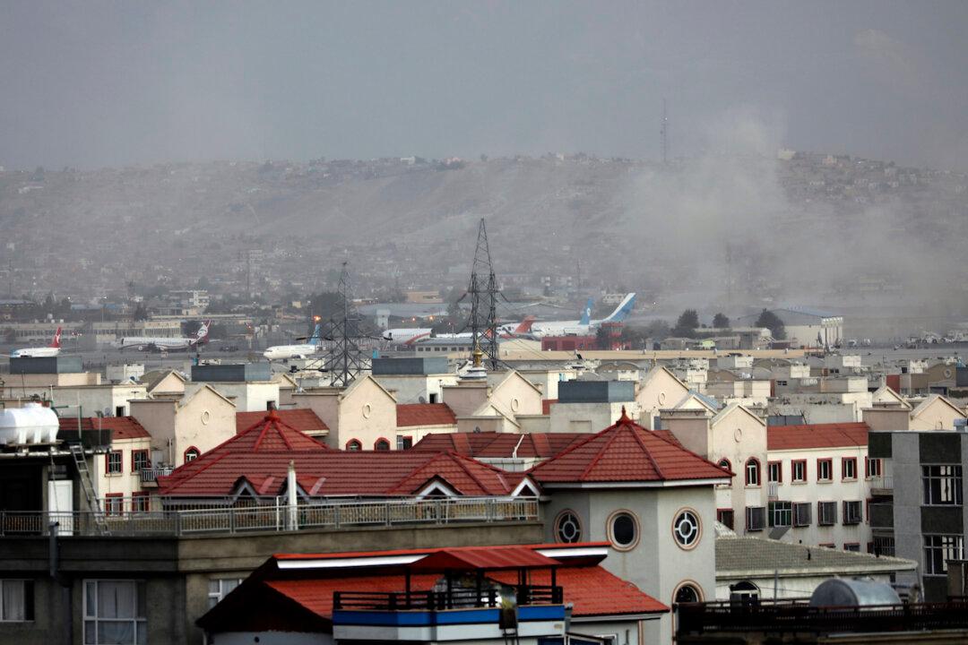 13 US Service Members Killed in Afghanistan Bombings; Biden Promises to Retaliate