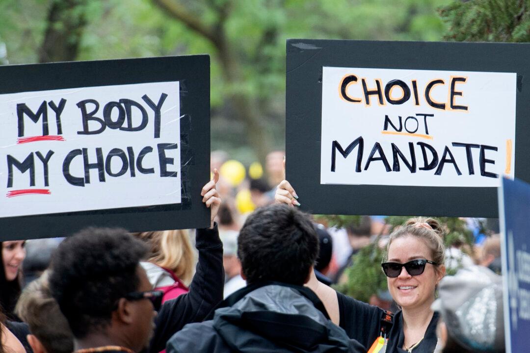 Protesters March in Toronto and Montreal Against Vaccine Mandates, Passports