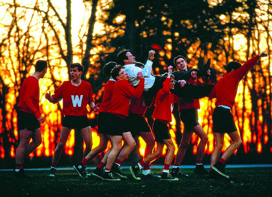 Mr. Keating (Robin Williams) is celebrated by his students, whom he has inspired to "seize the day," in "Dead Poets Society." (Touchstone Pictures/Warner Bros)