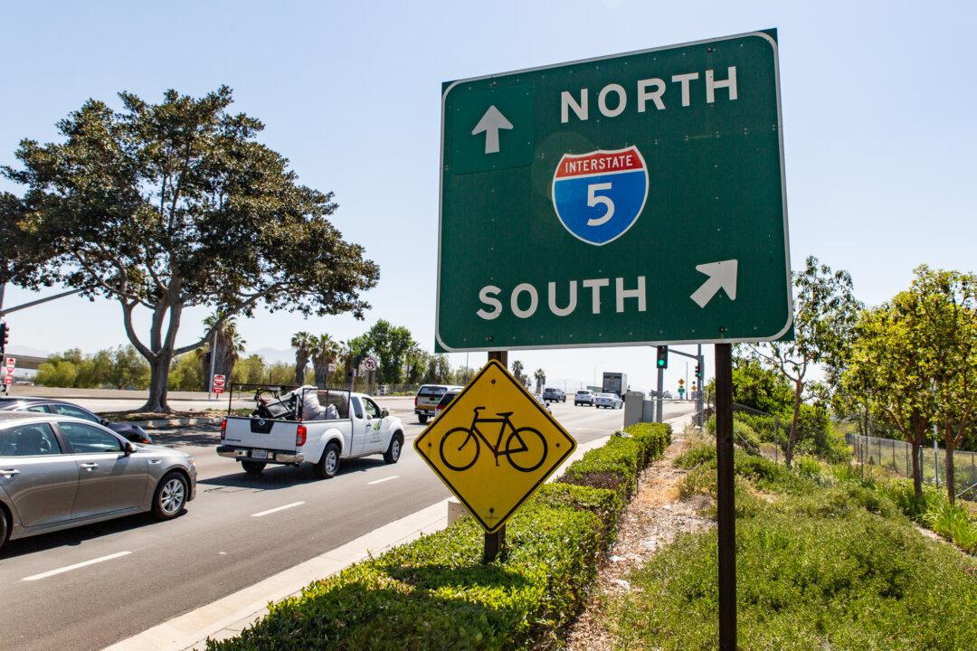 Two Arrested For Taking Cash That Fell From Armored Truck On Carlsbad Freeway