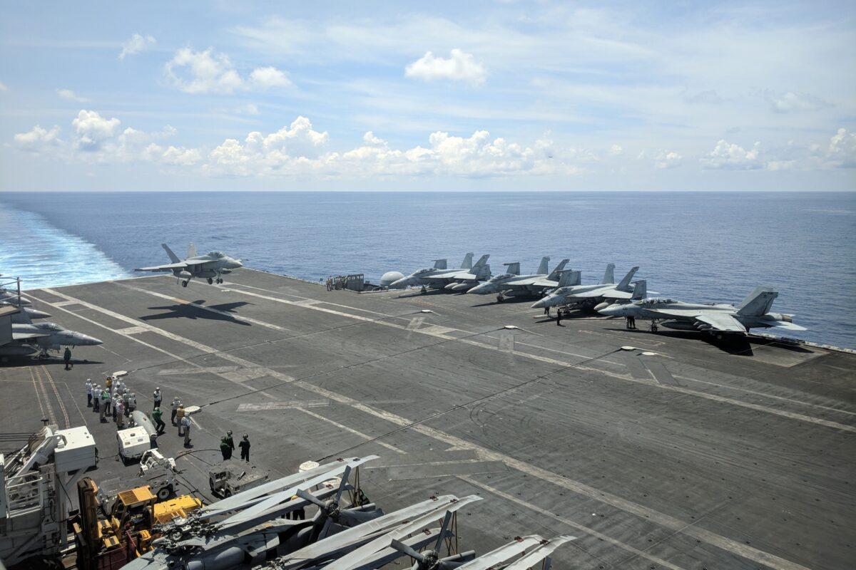 The USS Ronald Reagan aircraft carrier sails in the South China Sea on Oct. 16, 2019. (Catherine Lai/AFP via Getty Images)