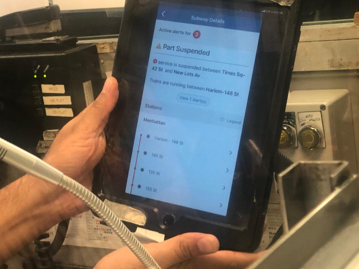 Busy customer service shows a tablet displaying subway service information at the 14th Street station in Manhattan, New York, on Sept. 2, 2021. (Enrico Trigoso/The Epoch Times)