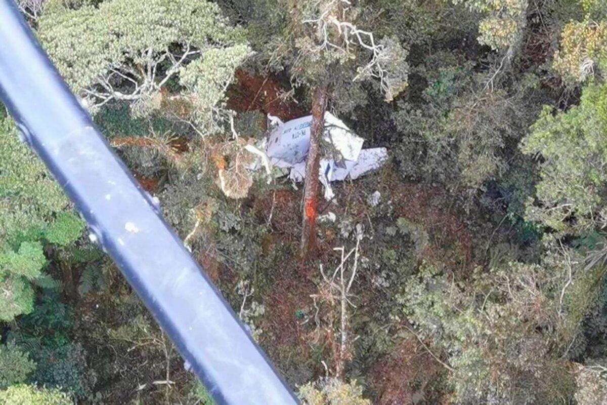 The wreckage of a small Rimbun Air cargo airplane is seen from a rescue helicopter in the mountain near Intan Jaya, Papua province, Indonesia, on Sept. 15, 2021. (Basarnas via AP)