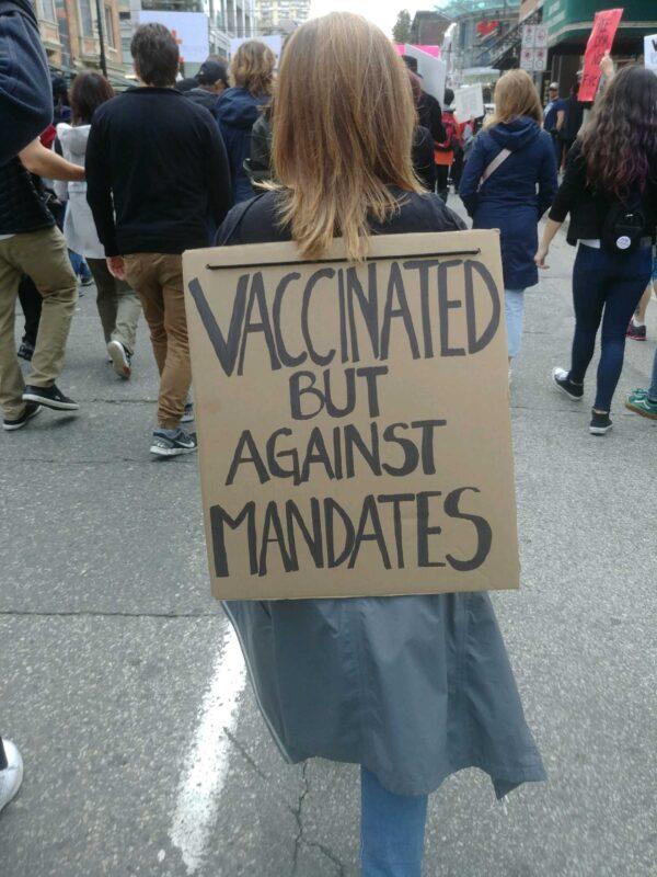 A woman takes part against COVID-19 restrictions and mandates in Vancouver on Sept. 18, 2021. (Jeff Sandes/The Epoch Times)