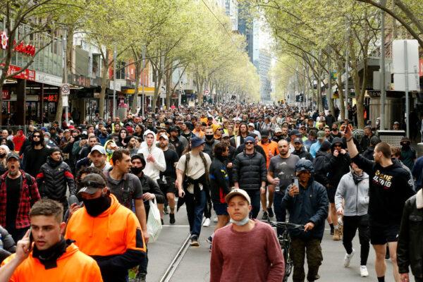Australians protesting lockdowns and vaccine mandates walk down Swanston Street in the Melbourne CBD, Australia, on Sept. 22, 2021. (Darrian Traynor/Getty Images)