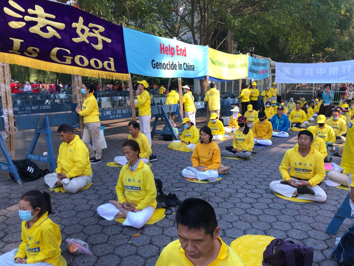 Falun Gong practitioners raise awareness about the persecution of their spiritual practice by the Chinese Communist Party in China, outside the U.N. building in New York, on Sept. 25, 2021. (Enrico Trigoso/The Epoch Times)