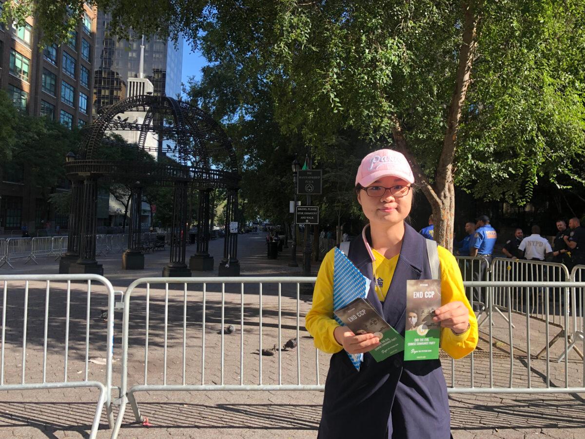 Falun Gong practitioner Helen Huang raising awareness about the persecution of their spiritual practice by the Chinese Communist Party in China, outside the U.N. building in New York, on Sept. 25, 2021. (Enrico Trigoso/The Epoch Times)
