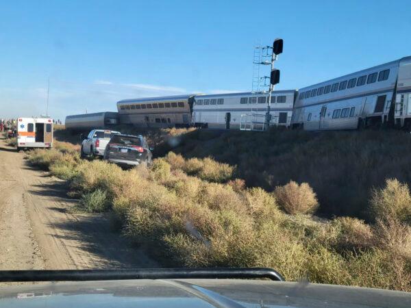 An ambulance is parked at the scene of an Amtrak train derailment in north-central Montana on Sept. 25, 2021. (Kimberly Fossen via AP)