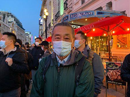 Protester surnamed Zhou at Piccadilly Circus, London, on Oct. 1, 2021. (Zhan Na/The Epoch Times)