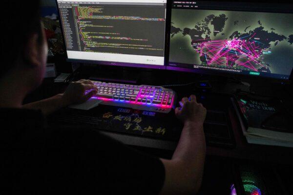 Prince, a member of the hacking group Red Hacker Alliance who refused to give his real name, uses a website that monitors global cyberattacks on his computer at their office in Dongguan, China's southern Guangdong province, on Aug. 4, 2020. (Nicolas Asfouri/AFP via Getty Images)