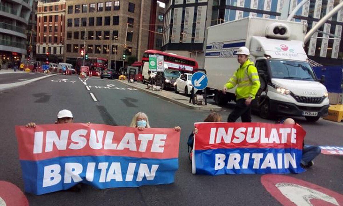 Handout photo issued by Insulate Britain of protesters from Insulate Britain blocking Old Street roundabout in central London on Oct. 8, 2021. (Insulate Britain via PA)