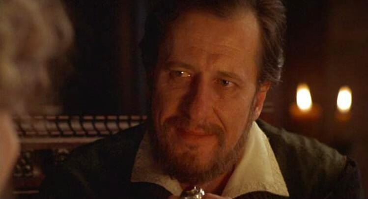 Sir Francis Walsingham (Geoffrey Rush) speaks of treasonous political alliances, in “Elizabeth.” (PolyGram Filmed Entertainment)