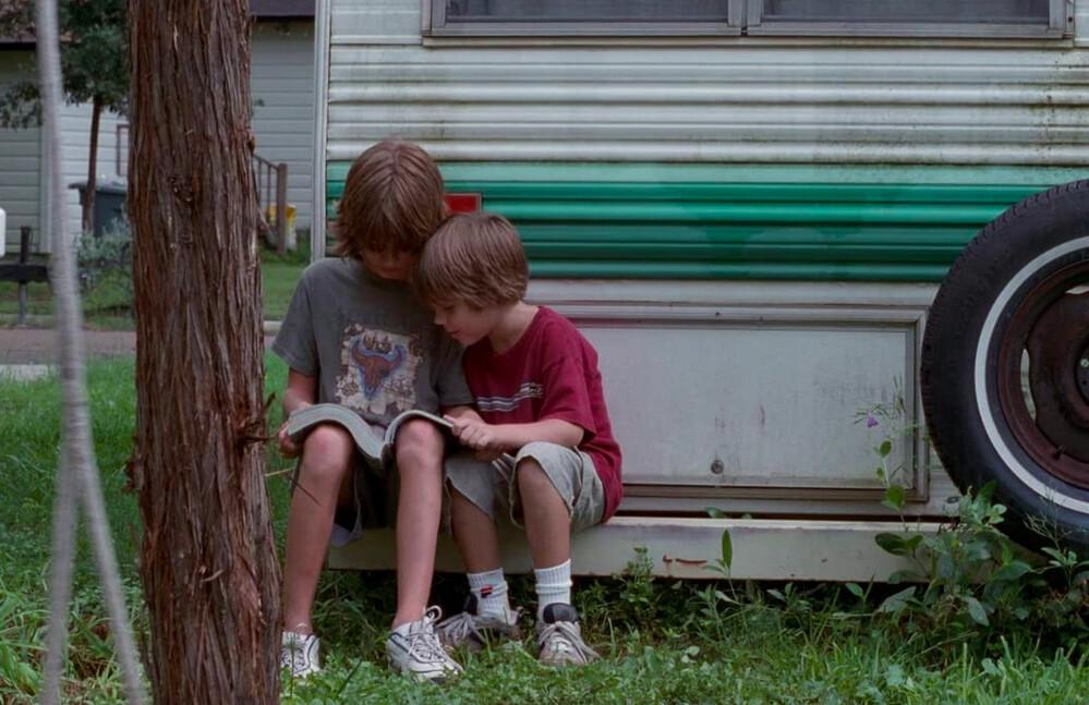 Jim (Brad Hawkins, L) and Mason Evans Jr. (Ellar Coltrane) have a gander at a lingerie magazine, in Richard Linklater’s “Boyhood.”(IFC Films/Universal Pictures)