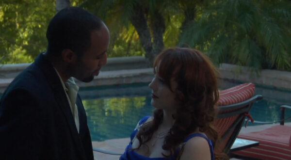 David (Gary Poux, L) drops some profound wisdom on wannabe actress Valerie (Nicole Kingston) in “Live Fast, Die Young.” (RiverRain Productions)