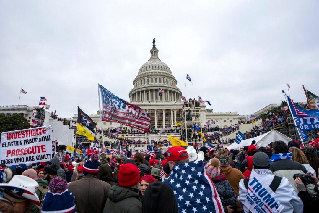 In Jan. 6 Footage, Either Officers ‘Stand Aside,’ or ‘Riotous Mob’ Breaches the Capitol