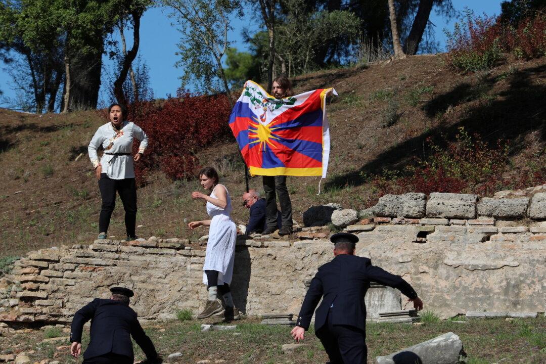Human Right Activists Stage Protest at Beijing Olympics Torch-Lighting Ceremony