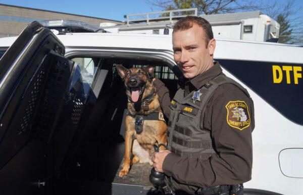 Drug dog Phoenix with handler Josh James of the Sanilac Country Sheriff's Office in Sandusky, Michigan, on Oct. 18, 2021. (Steven Kovac/Epoch Times)