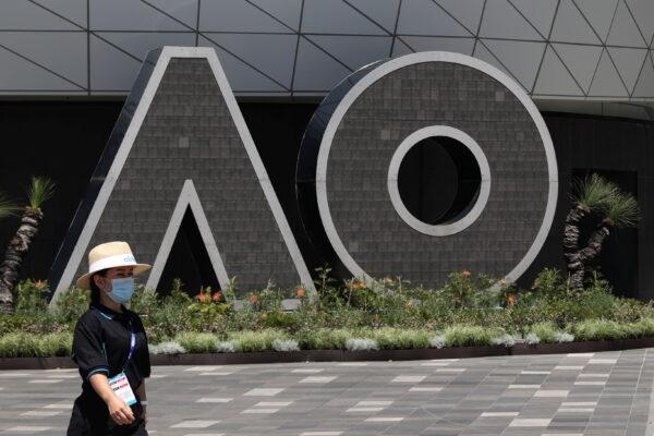 A person walks past an Australian Open logo at Melbourne Park in Melbourne, Australia, on Jan. 31, 2021. (Loren Elliott/Reuters)