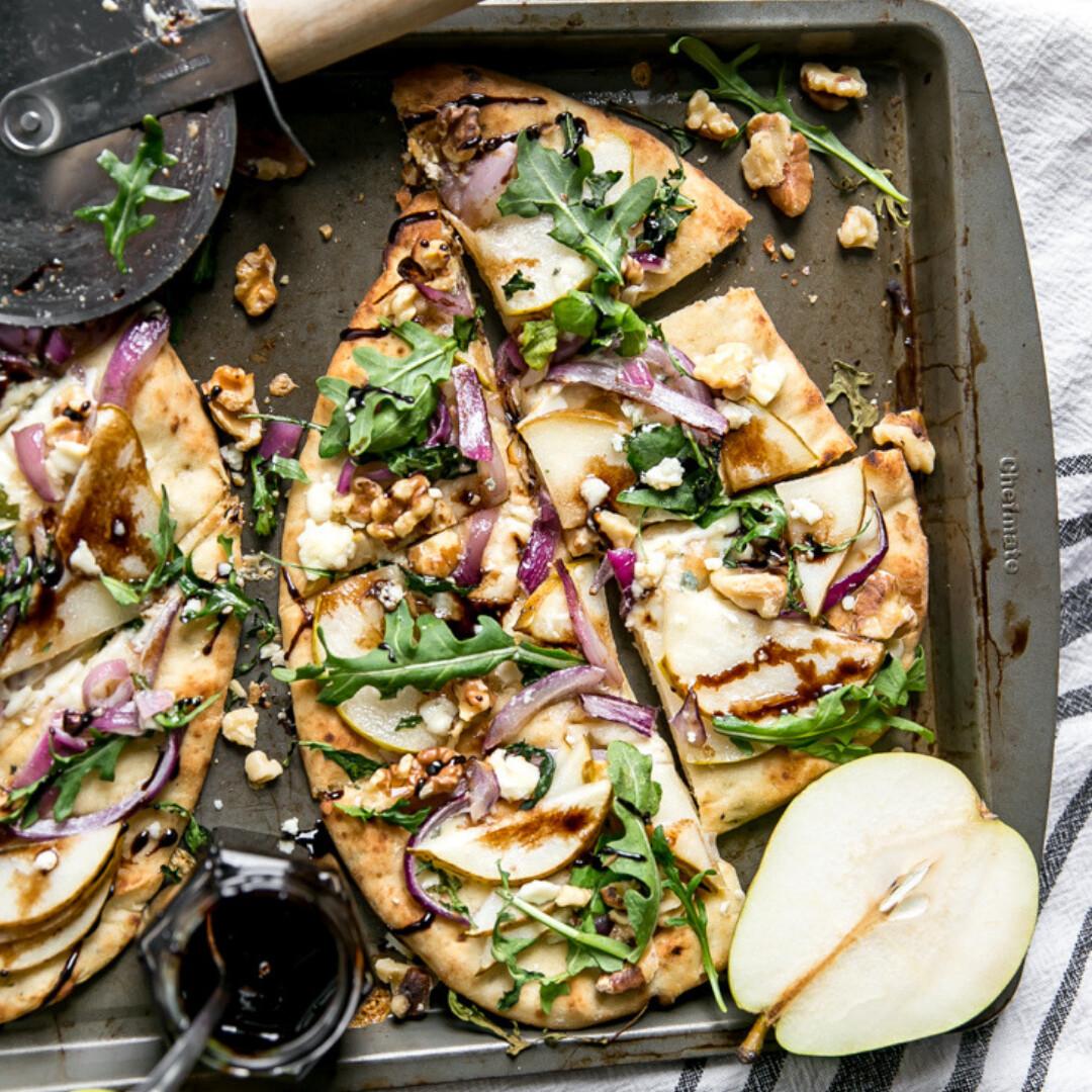 Pear and Walnut Flatbread With Gorgonzola, Arugula, and Balsamic Glaze