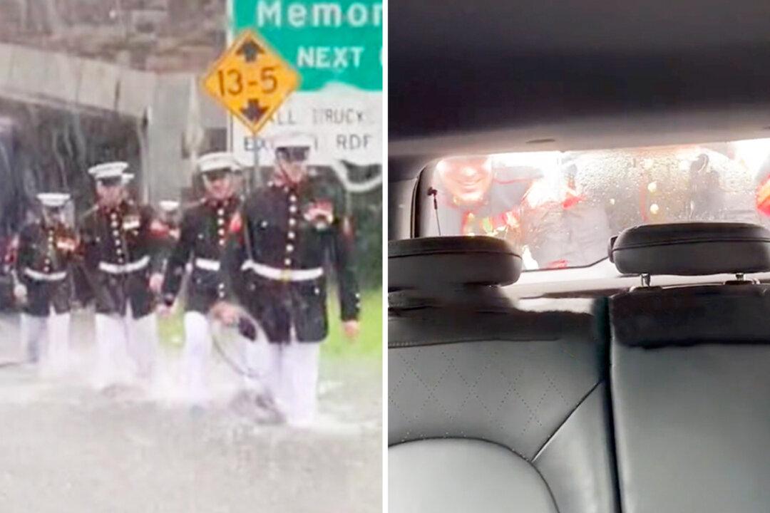 Video: Stranded Woman Films Uniformed Marines Pushing Her Car Out of Flood Waters