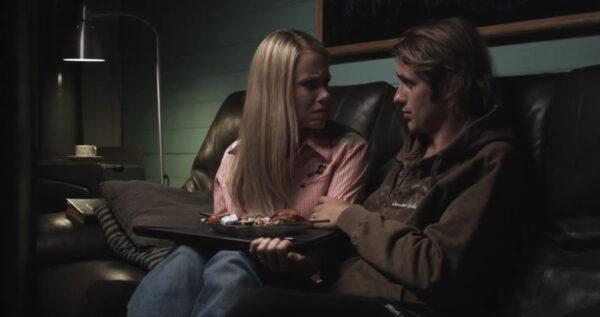 Gwen O’Brien (Shannen Fields), left, supports her husband, Luke (Bart Bronson), in “Suing the Devil”. (Mouthwatering Productions)
