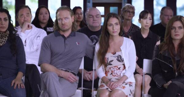 Shane Badman (John Terrell, L) rolling his eyes during a church service with his wife Hannah (Emilie Soghomonian) in “Journey to Hell.” (VGC Productions)