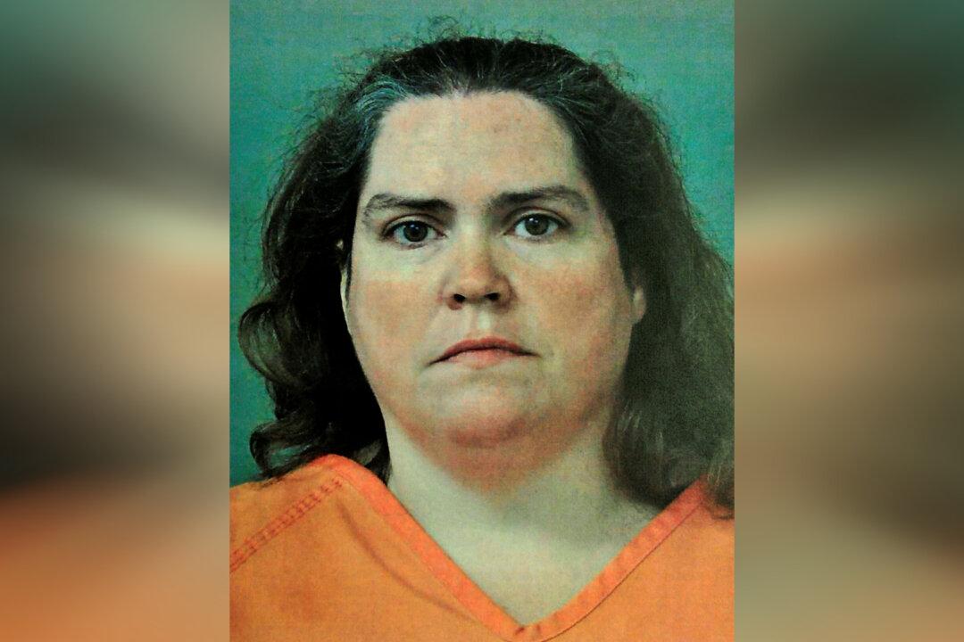 Woman Gets Life Sentence for Helping Husband Plan Killings