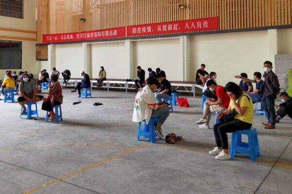Residents wait for COVID-19 coronavirus testing in Ruili in China's southwestern Yunnan Province on Sept. 15, 2020. (STR/AFP via Getty Images)