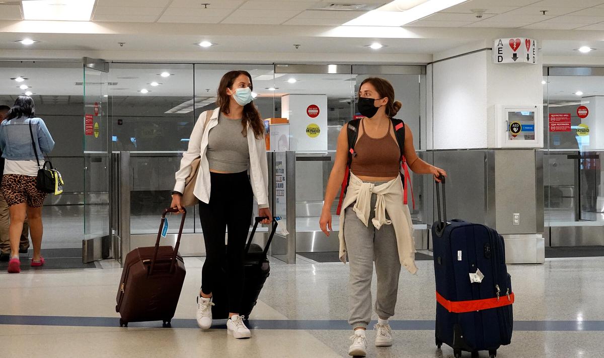 Omicron Variant Threatening Economic Recovery Amid New Travel Restrictions