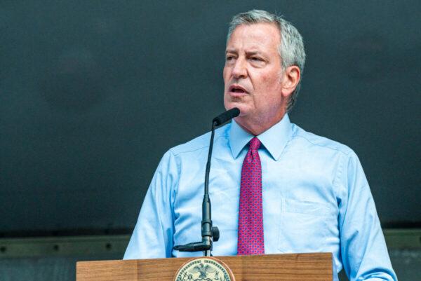 New York City Mayor Bill DeBlasio presents a proclamation at the 46th Precincts National Night Out in the Bronx borough of New York City, on Aug. 3, 2021. (David Dee Delgado/Getty Images)