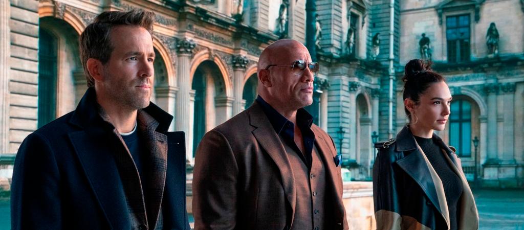 Film Review: ‘Red Notice’: Reynolds, Gadot, and Johnson Display Winning Chemistry