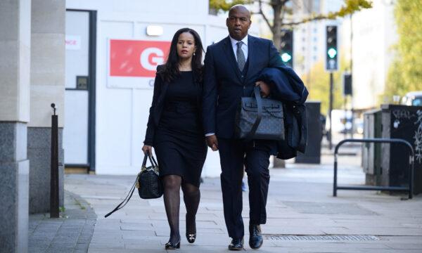 Labour MP Claudia Webbe (L), who has since been expelled from the party, arrives with her partner Lester Thomas at The City of Westminster Magistrates Court in London on Nov. 4, 2021. (Leon Neal/Getty Images)