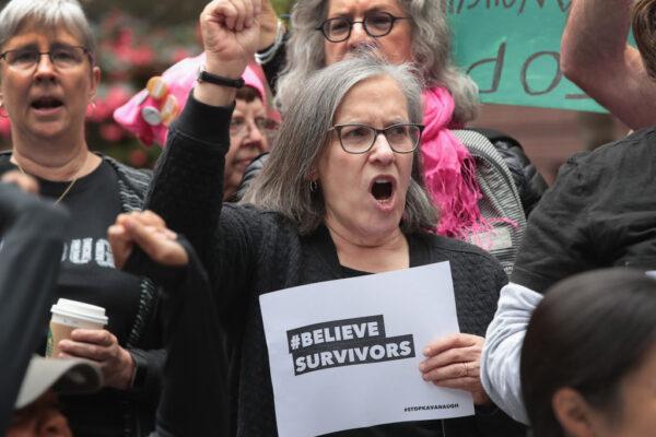 Activists and advocates for survivors of sexual abuse gather in the Federal Building Plaza to protest the confirmation of Supreme Court nominee Brett Kavanaugh in Chicago, Ill., on Sept. 28, 2018. (Scott Olson/Getty Images)