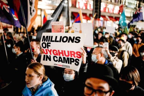 Demonstrators supporting Tibetans, Uyghurs, and Hong Kongers take part in a protest against the Chinese Communist Party as they march along Regent Street towards the Chinese Embassy in London, on Oct. 1, 2021. (Matt Dunham, File/AP Photo)