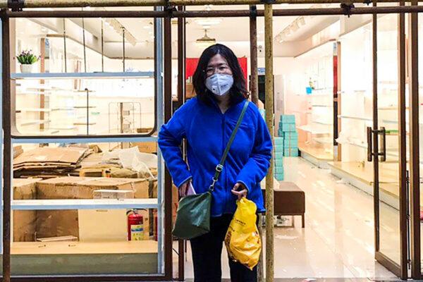 Zhang Zhan stands outside a shop during a visit to Wuhan in Hubei province, China, on April 11, 2020. (Courtesy of Melanie Wang via AP)