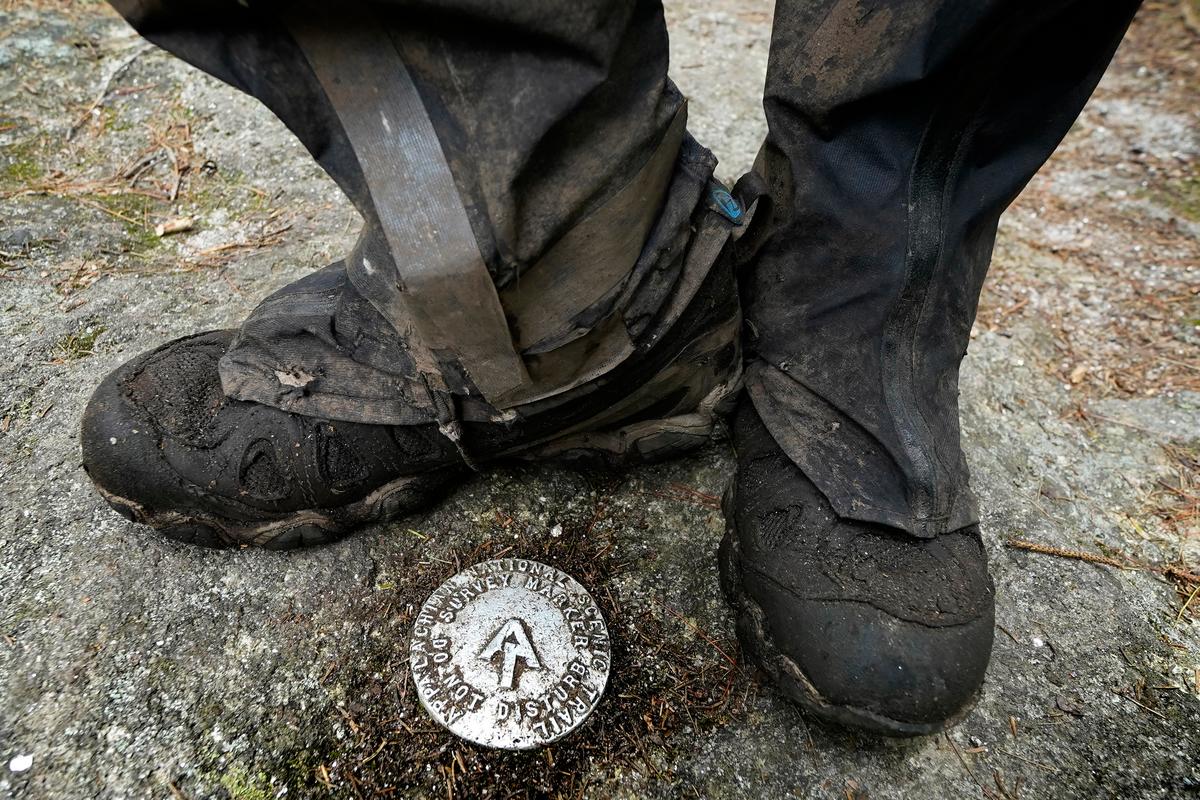 M.J. Eberhart, 83, pauses by a survey marker. (Robert F. Bukaty/AP Photo)