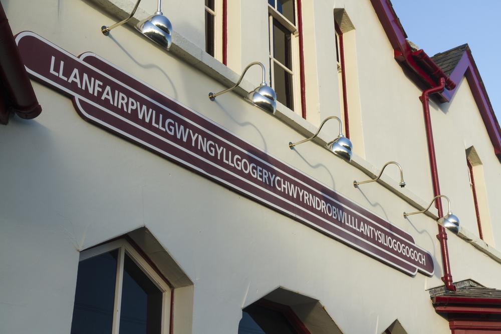 Llanfairpwllgwyngyllgogerychwyrndrobwllllandysiliogogogoch is referred to by its nickname, LlanfairPG. (Andrew Chisholm/Shutterstock)