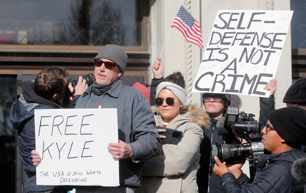 People await the verdict in the trial of Kyle Rittenhouse, outside the Kenosha County Courthouse in Kenosha, Wis., on Nov. 19, 2021. (Brendan McDermid/Reuters)