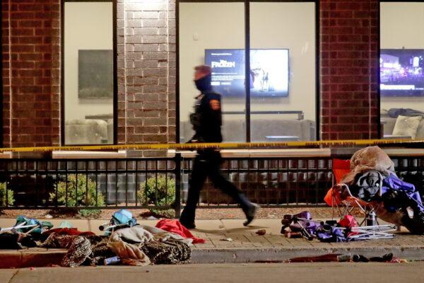 Police investigate after a vehicle plowed through a Christmas parade, leaving multiple people dead and injured in Waukesha, Wis., on Nov. 21, 2021. (Mike De Sisti/USA TODAY NETWORK/Reuters)