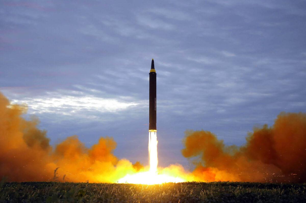 North Korea's intermediate-range strategic ballistic rocket Hwasong-12 lifts off from the launching pad at an undisclosed location near Pyongyang, on Aug. 29, 2017. (STR/AFP via Getty Images)