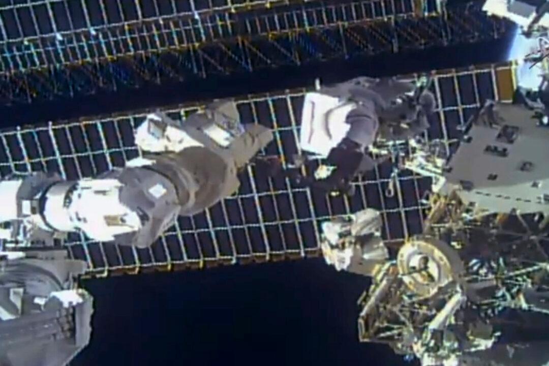 Spacewalking Astronauts Replace Antenna After Debris Scare