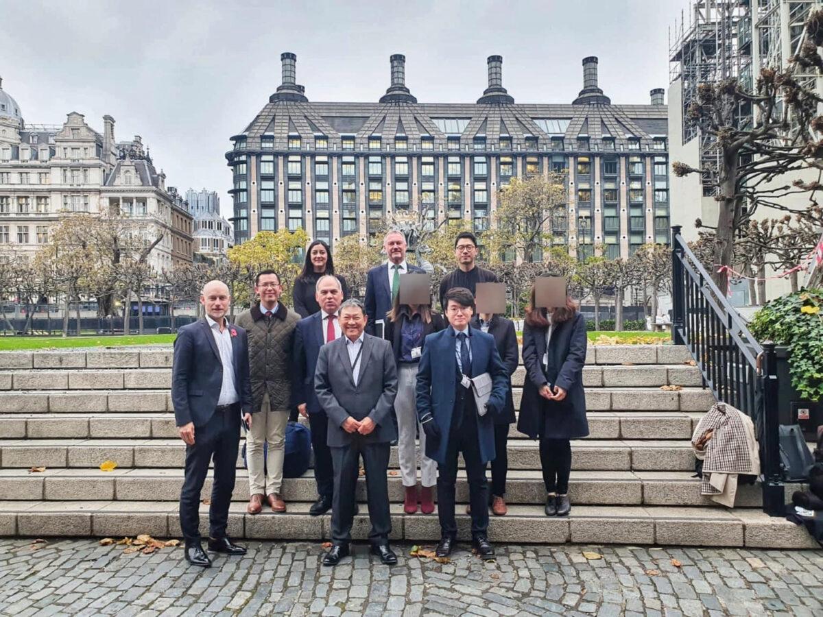 A photo, a copy of which was shared in a WeChat group accompanied by a reward offer for information of Simon Cheng (1st row, R) and Nathan Law (3rd row, R), showing members of Hong Kong expats groups and four Labour MPs. (Courtesy of Simon Cheng)