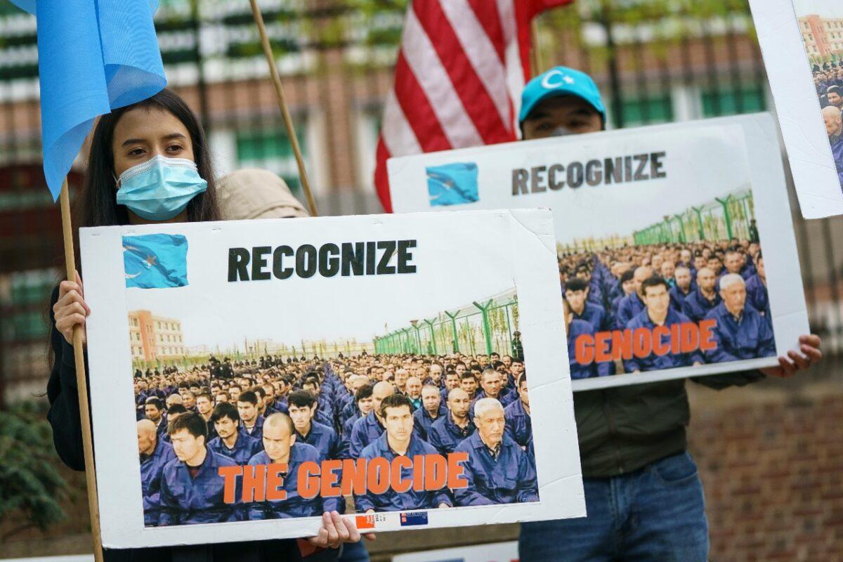 Supporters of the East Turkistan National Awakening Movement rally in front of the British Embassy in Washington on April 16, 2021. The group is calling for Uyghurs and other Turkic people fleeing Xinjiang, China, to be granted refugee status and calling for an international boycott of the 2022 Winter Olympic Games in Beijing. (Drew Angerer/Getty Images)