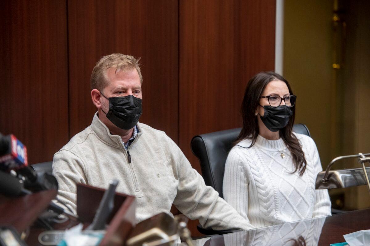 Jeffrey Franz and his wife Brandi listen as attorney Geoffrey Fieger holds a news conference at his offices in Southfield, Mich., on Dec. 9, 2021. (David Guralnick /Detroit News via AP)